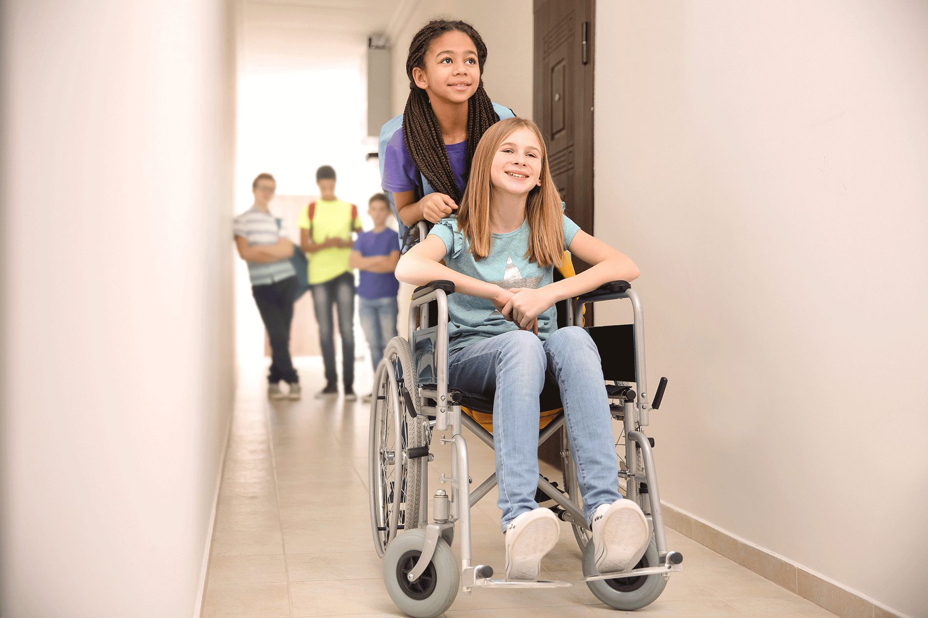 Picture of a gal being pushed in a wheelchair