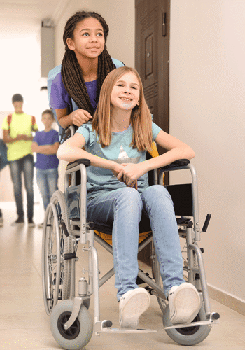 Picture of a gal being pushed in a wheelchair